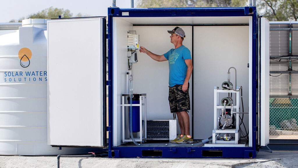 containerized seawater reverse osmosis (SWRO) system with integrated control panel and high-pressure components