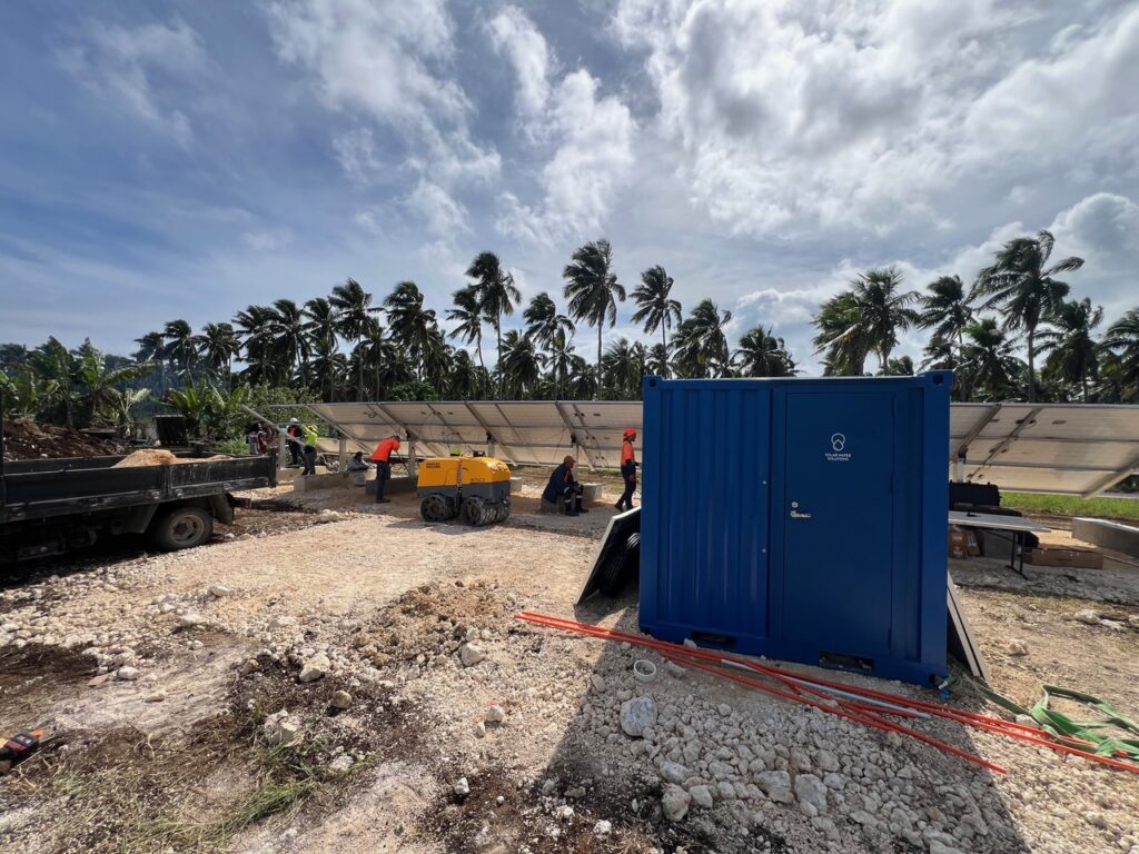 solar-powered water purification system in a container on an island